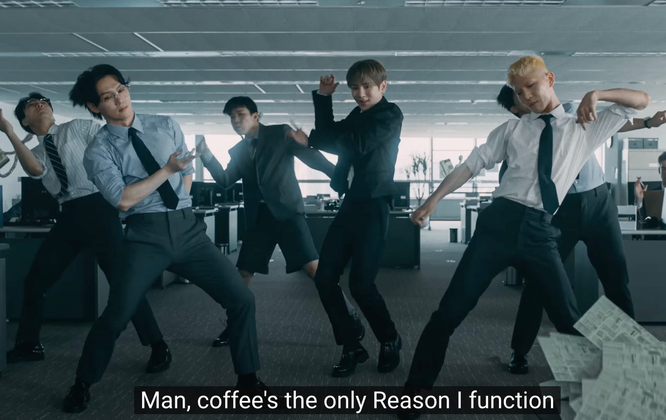 screenshot of Key's Good & Great MV, where the subtitle says "Man, coffee's the only Reason I function"