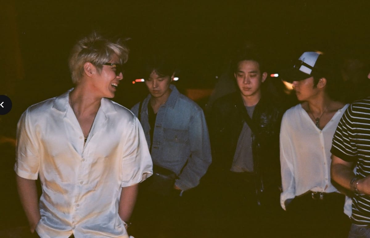 The Rose band members walking through Coachella at night