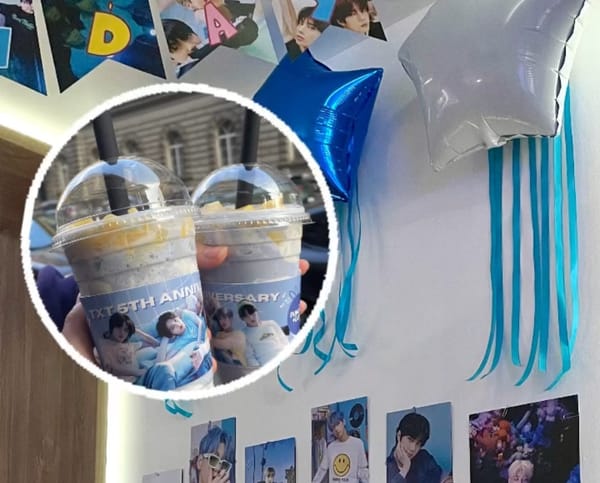 Light blue-themed decorations including signs, balloons, and photos inalid with a photo of two drinks.